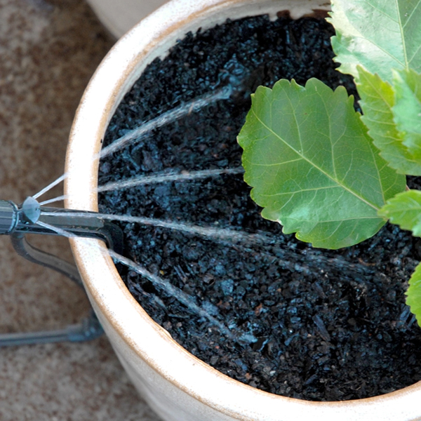 Riego localizado de plantas en maceta con emisor PotStream de caudal ajustable